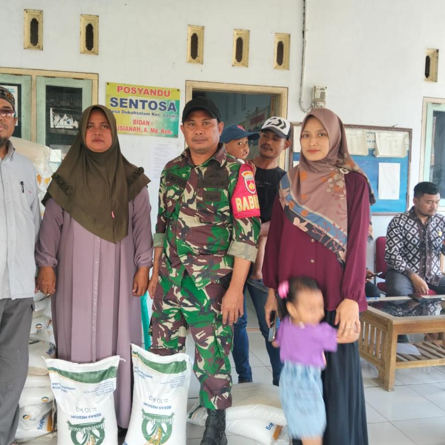 PEMBAGIAN BERAS BANTUAN PANGAN DESA DUKUHSALAM  